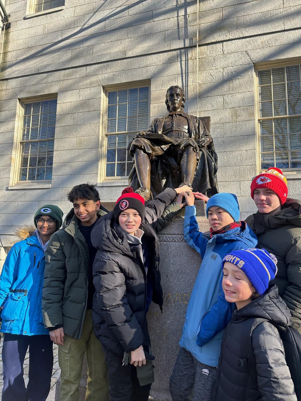 Students at Harvard statue