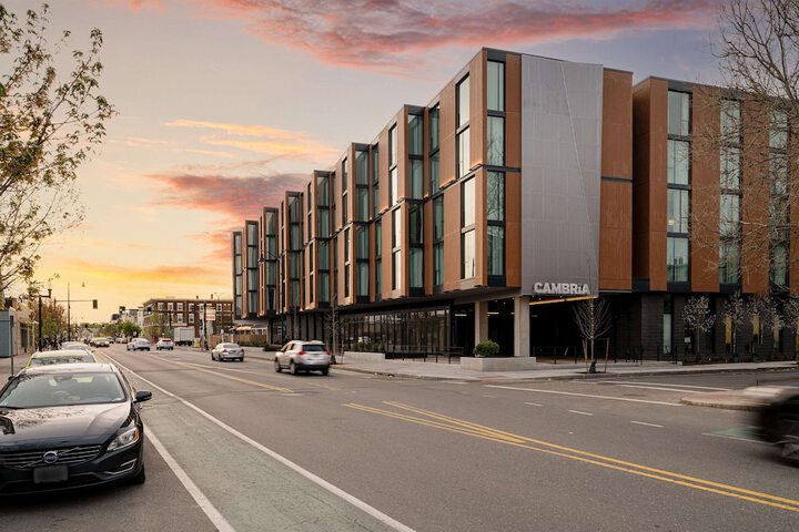 Cambria Hotel exterior at sunset